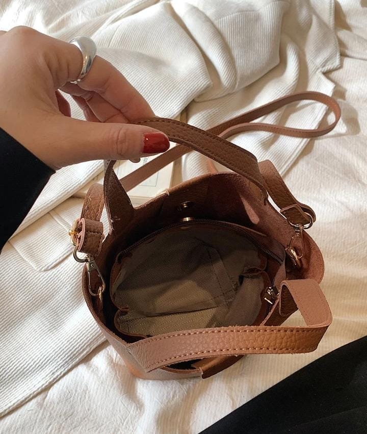 Small Litchi Embossed Bucket Bag With Pom Pom Bag Charm 536700 Small Litchi Embossed Bucket Bag With Pom Pom Bag Charm 536700