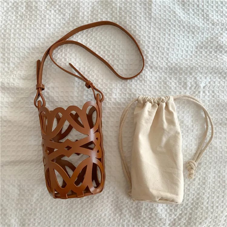 Anagram Cut-out Pocket Pouch in Classic Calfskin & Canvas LF5736 Anagram Cut-out Pocket Pouch in Classic Calfskin & Canvas LF5736
