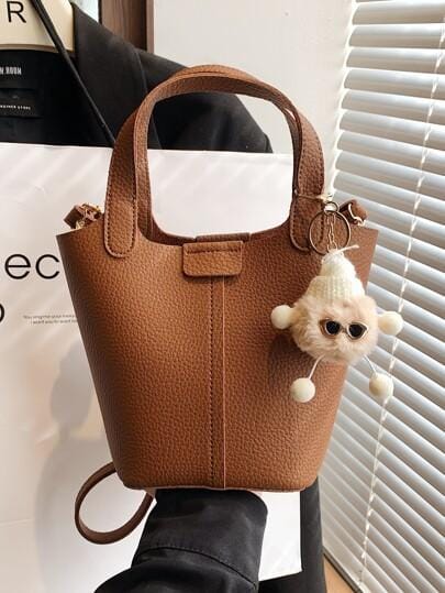 Small Litchi Embossed Bucket Bag With Pom Pom Bag Charm 536700 Small Litchi Embossed Bucket Bag With Pom Pom Bag Charm 536700